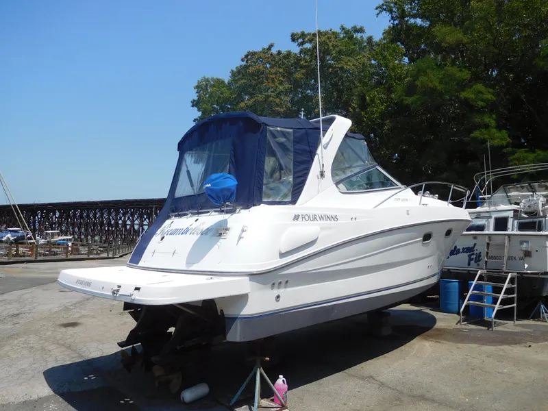 Slide: The Image of 2001 Four Winns 298 Vista boat on dry dock. - 1