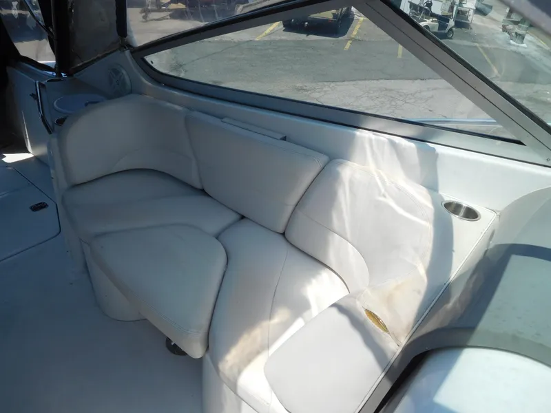 Slide: The Image of 2001 Four Winns 298 Vista boat interior with white leather seating. - 12