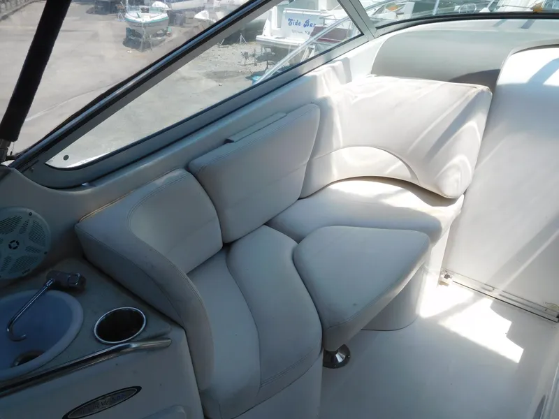 Slide: The Image of 2001 Four Winns 298 Vista boat interior with white cushioned seating. - 13