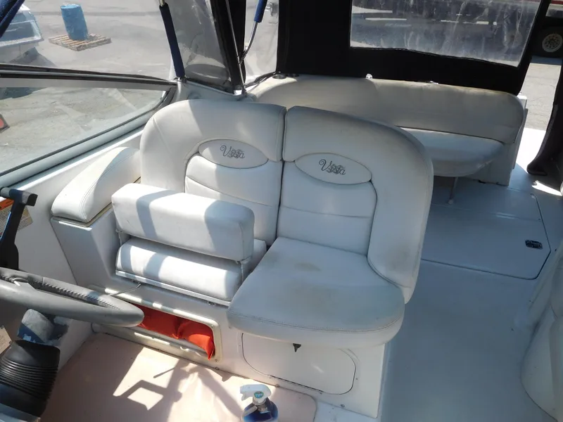 Slide: The Image of 2001 Four Winns 298 Vista boat interior with white leather seating. - 17