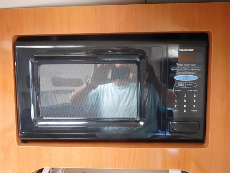 Slide: The Image of Built-in microwave in 2001 Four Winns 298 Vista boat kitchen. - 22