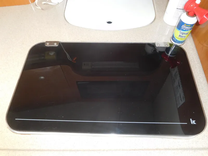 Slide: The Image of 2001 Four Winns 298 Vista boat interior countertop with black glass cover. - 23