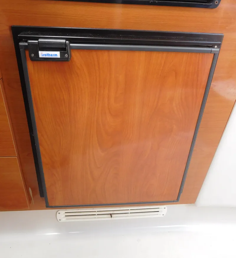 Slide: The Image of Built-in refrigerator on a 2001 Four Winns 298 Vista boat. - 24