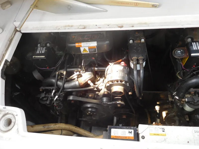 Slide: The Image of 2001 Four Winns 298 Vista engine compartment with visible components and wiring. - 32