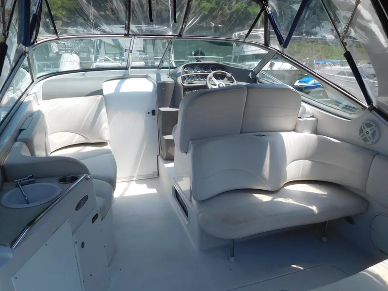 Slide: The Image of 2001 Four Winns 298 Vista boat interior with white seating and helm. - 5