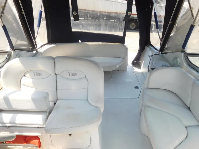Slide: The Image of 2001 Four Winns 298 Vista boat interior with white seating and enclosed canopy. - 7