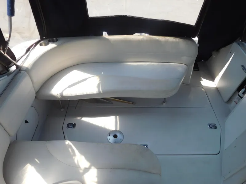 Slide: The Image of Interior seating of 2001 Four Winns 298 Vista boat with white upholstery. - 9