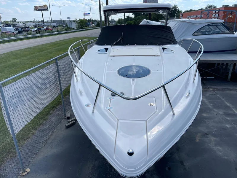 Slide: The Image of 2025 Regal 33 Express boat docked, front view. - 2