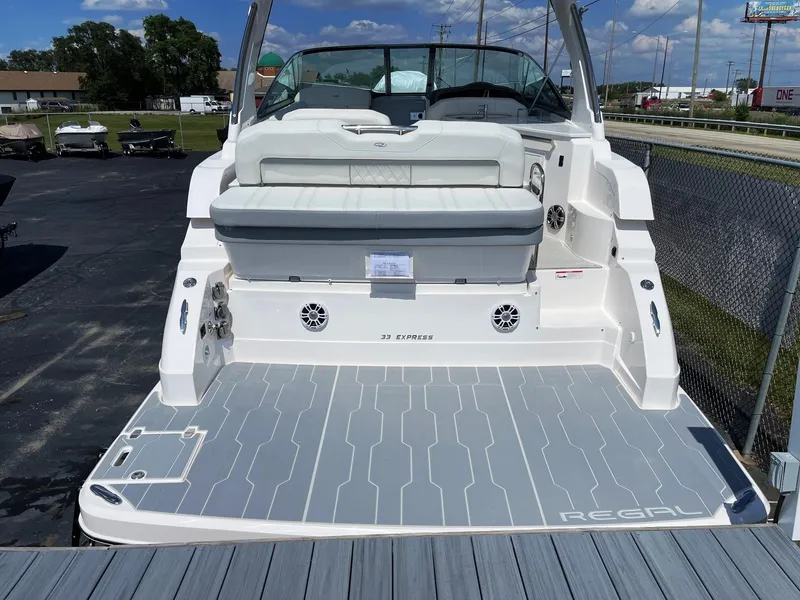 Slide: The Image of 2025 Regal 33 Express boat with spacious deck and seating. - 3