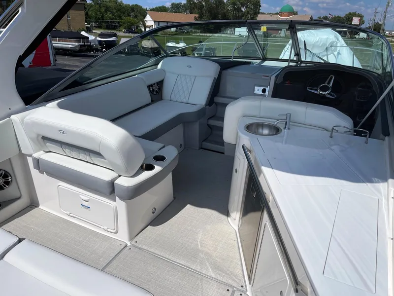 Slide: The Image of 2025 Regal 33 Express boat interior with white seating and modern amenities. - 4