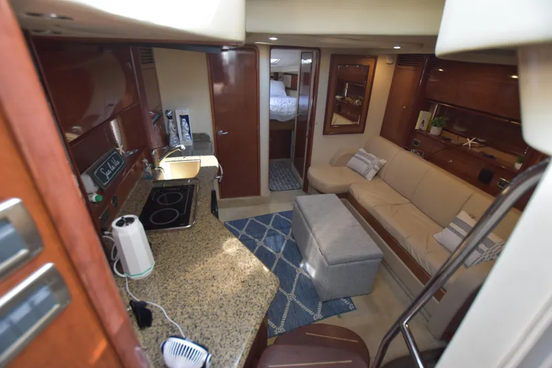 Slide: The Image of Interior of 2006 Sea Ray 40 Sundancer yacht with kitchen and lounge area. - 18
