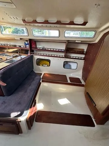 Slide: The Image of Interior of 1983 Catalina 30 Tall Rig sailboat with seating and storage. - 17