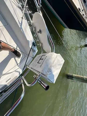 Slide: The Image of 1983 Catalina 30 Tall Rig sailboat deck with grill and water view. - 21