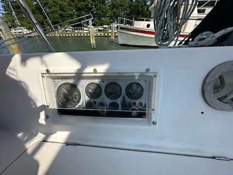 Slide: The Image of Control panel on 1983 Catalina 30 Tall Rig sailboat, docked near other boats. - 25