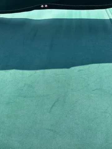 Slide: The Image of Green fabric cover on a 1983 Catalina 30 Tall Rig sailboat. - 30