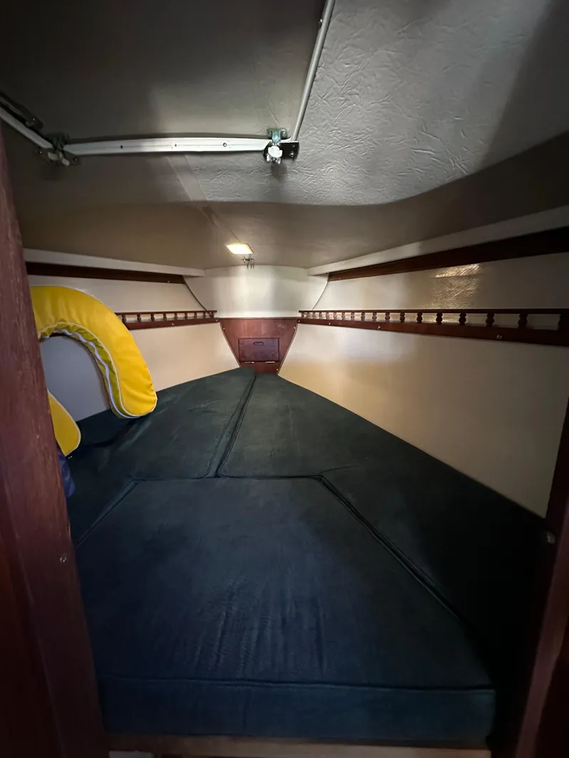 Slide: The Image of Interior cabin of 1983 Catalina 30 Tall Rig sailboat with cushions and storage. - 37