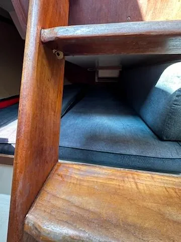 Slide: The Image of Wooden interior of 1983 Catalina 30 Tall Rig sailboat with cushioned seating. - 9