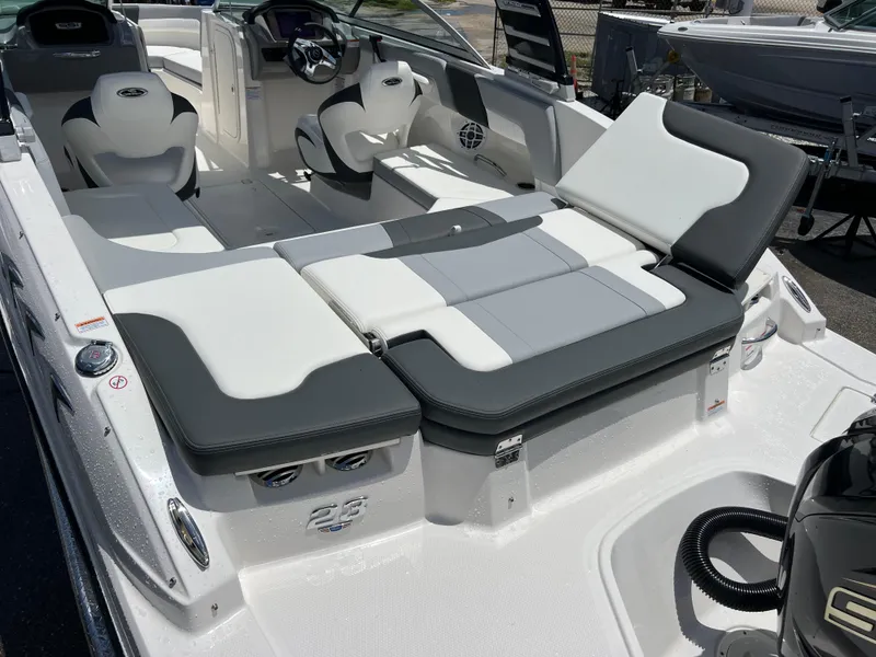 Slide: The Image of 2024 Chaparral 23 SSi OB boat interior with white and gray seating. - 6