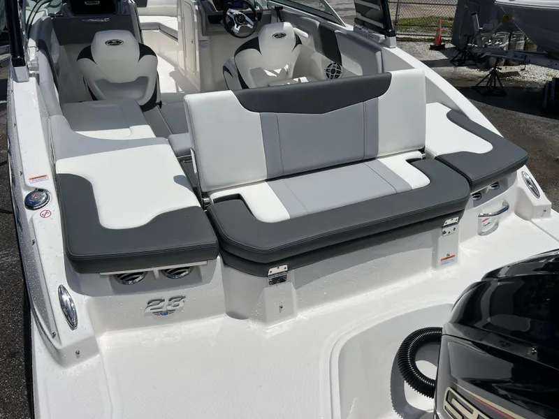 Slide: The Image of 2024 Chaparral 23 SSi OB boat interior with seating and steering console. - 7