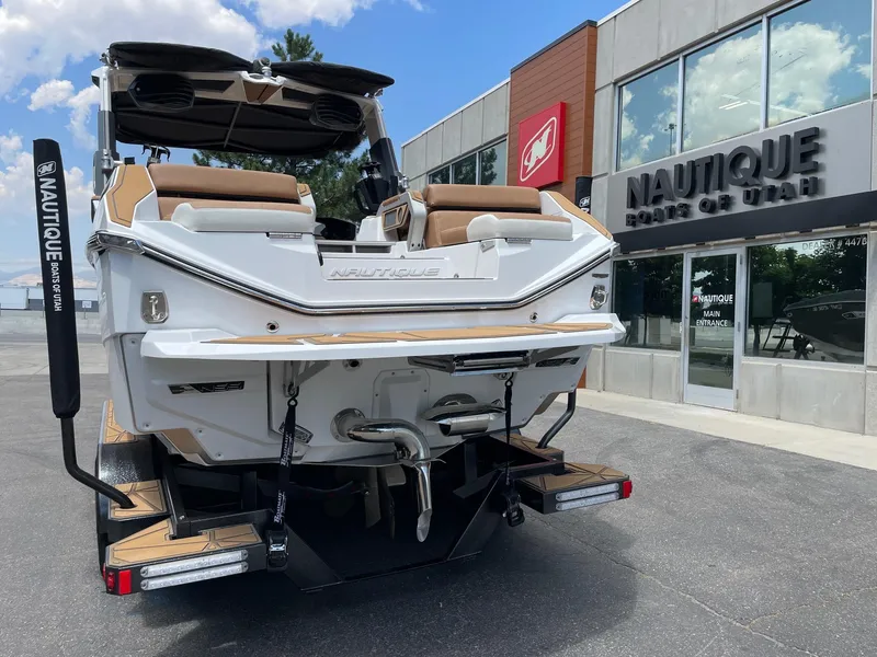 Slide: The Image of 2024 Nautique Super Air Nautique G25 Paragon at dealership, rear view. - 5