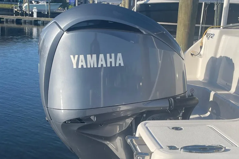 Slide: The Image of 2022 Robalo R272 Center Console with Yamaha outboard motor at dock. - 4