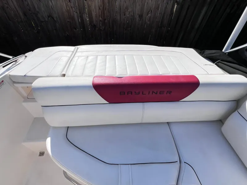 Slide: The Image of 2016 Bayliner 195 Deck Boat, white and red seating area. - 13