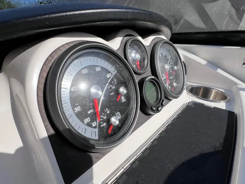 Slide: The Image of Close-up of 2016 Bayliner 195 Deck Boat dashboard gauges. - 18
