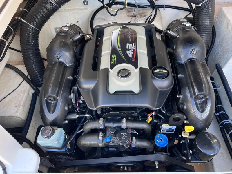 Slide: The Image of 2016 Bayliner 195 Deck Boat engine compartment with 4.3L MerCruiser engine. - 29
