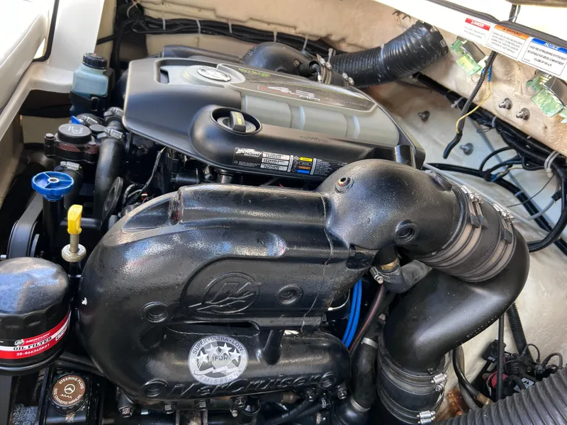 Slide: The Image of 2016 Bayliner 195 Deck Boat engine compartment with visible components. - 30