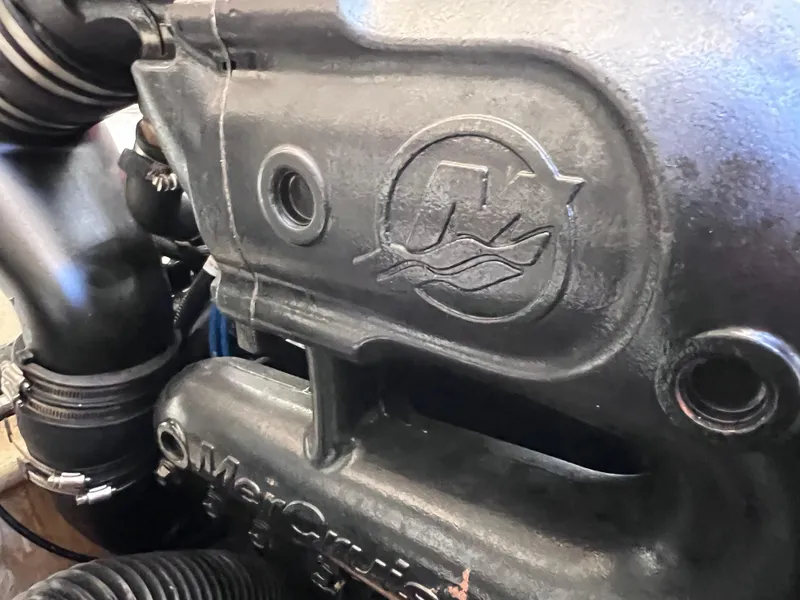 Slide: The Image of Close-up of a 2016 Bayliner 195 Deck Boat engine component. - 33