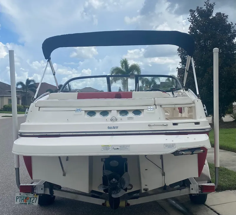 Slide: The Image of 2016 Bayliner 195 Deck Boat with Bimini top, rear view. - 34