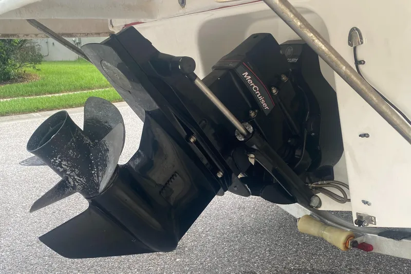 Slide: The Image of Close-up of a 2016 Bayliner 195 Deck Boat's MerCruiser outboard motor. - 36