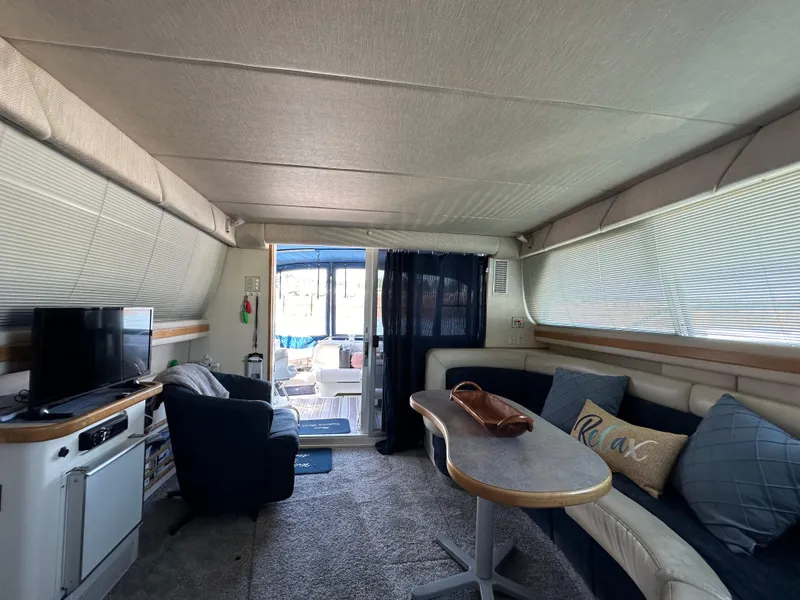 Slide: The Image of Interior of 1996 Sea Ray 370 Sedan Bridge with cozy seating and modern amenities. - 10