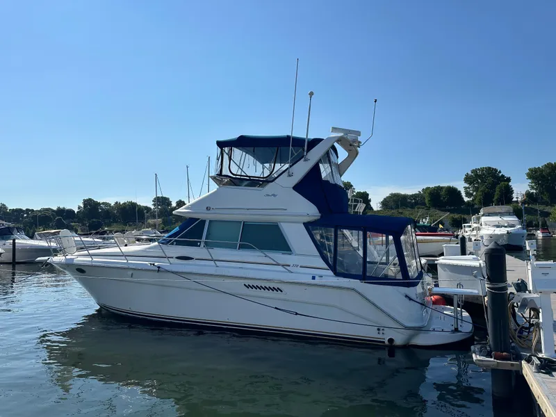 Slide: The Image of 1996 Sea Ray 370 Sedan Bridge yacht docked at marina. - 23