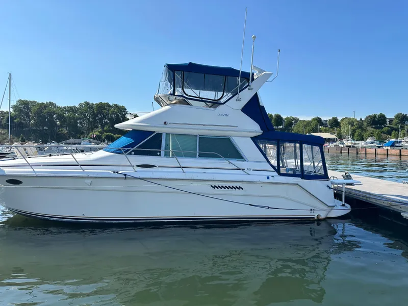 Slide: The Image of 1996 Sea Ray 370 Sedan Bridge yacht docked at marina. - 24