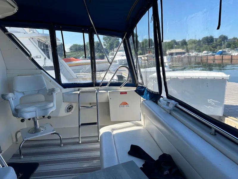 Slide: The Image of Interior of 1996 Sea Ray 370 Sedan Bridge yacht with seating and helm station. - 36