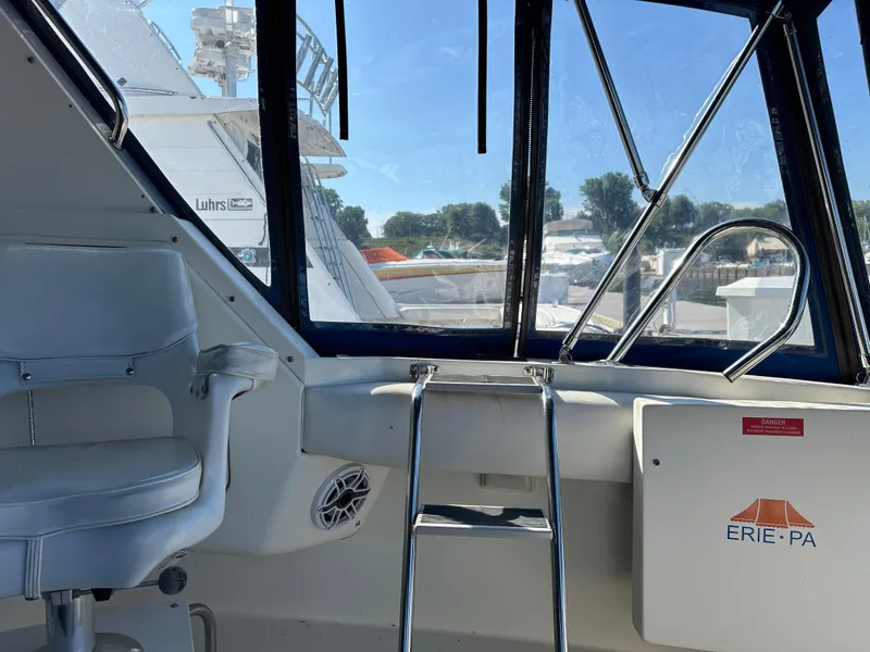 Slide: The Image of Interior view of 1996 Sea Ray 370 Sedan Bridge yacht with Erie, PA sign. - 41