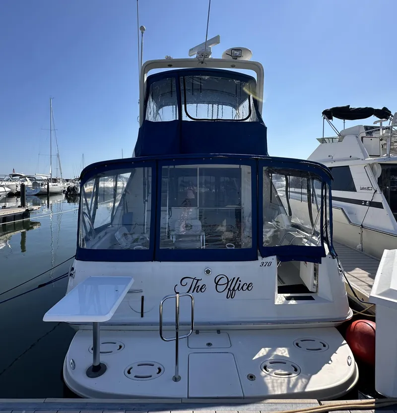 Slide: The Image of 1996 Sea Ray 370 Sedan Bridge yacht named The Office docked at a marina. - 43