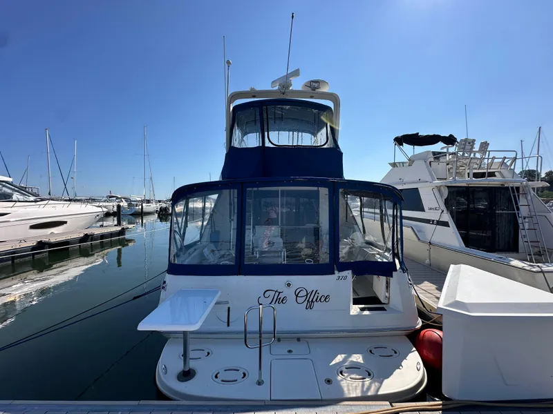 Slide: The Image of 1996 Sea Ray 370 Sedan Bridge docked at marina, rear view. - 44
