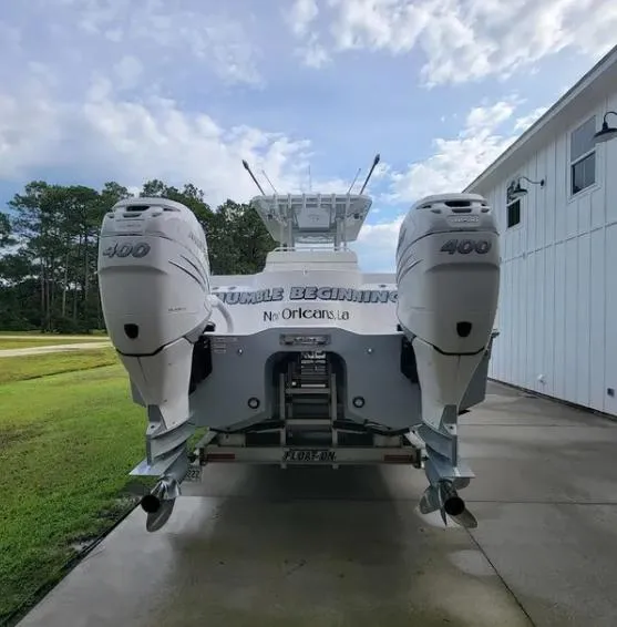 Slide: The Image of 2022 Invincible 33 Catamaran with twin 400 engines, rear view. - 4