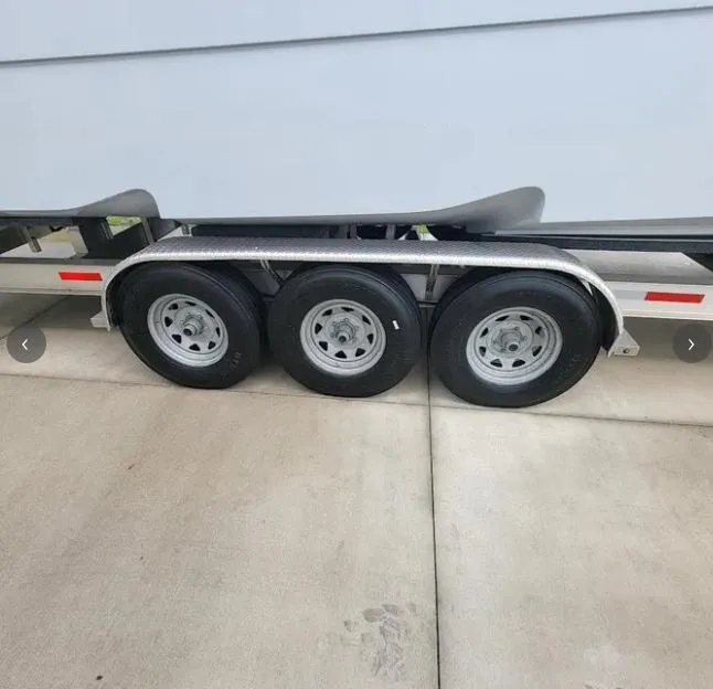Slide: The Image of Triple-axle trailer for 2022 Invincible 33 Catamaran on concrete driveway. - 7
