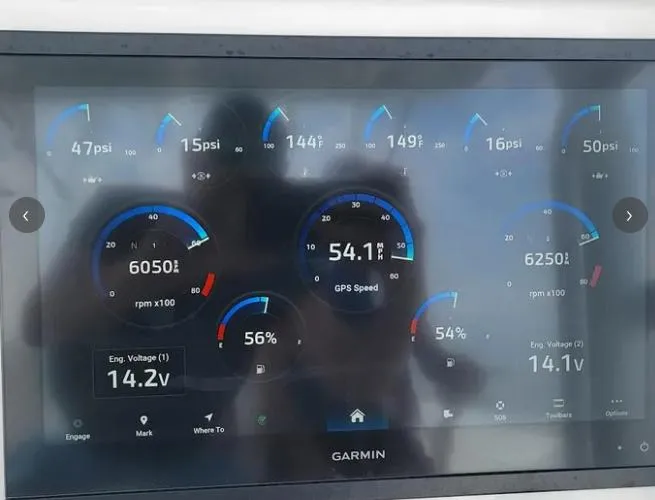 Slide: The Image of Garmin display on 2022 Invincible 33 Catamaran showing engine and speed metrics. - 8