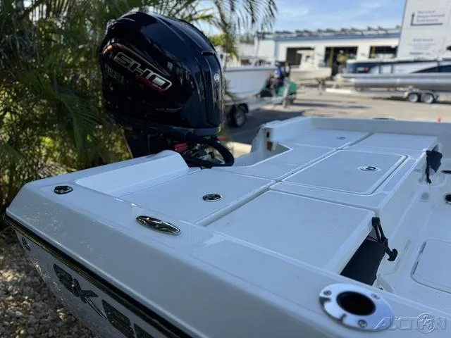 Slide: The Image of 2024 Skeeter SX230 boat with Yamaha SHO engine, docked outdoors. - 12