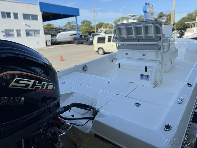 Slide: The Image of 2024 Skeeter SX230 boat with Yamaha SHO VMAX engine at a dealership. - 14