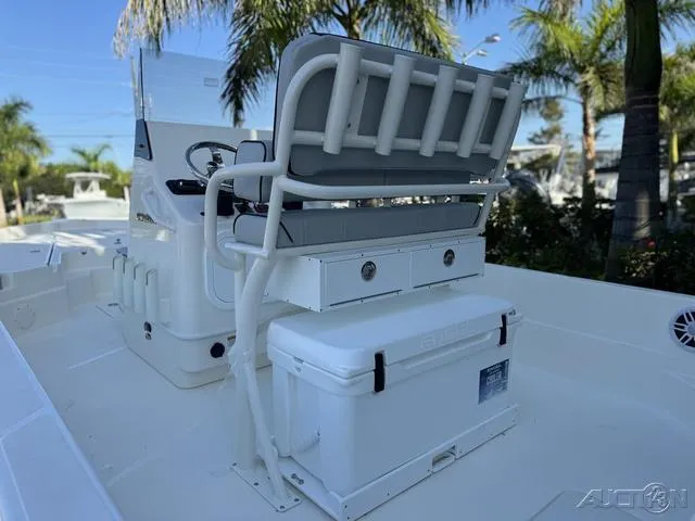Slide: The Image of 2024 Skeeter SX230 boat interior with seating and storage compartments. - 22