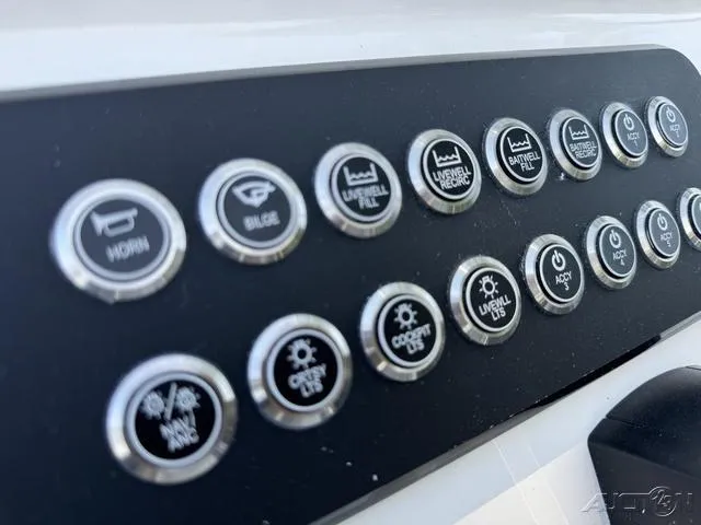 Slide: The Image of Control panel of 2024 Skeeter SX230 boat with various function buttons. - 25