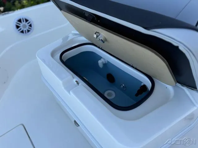 Slide: The Image of Livewell compartment on a 2024 Skeeter SX230 boat. - 27