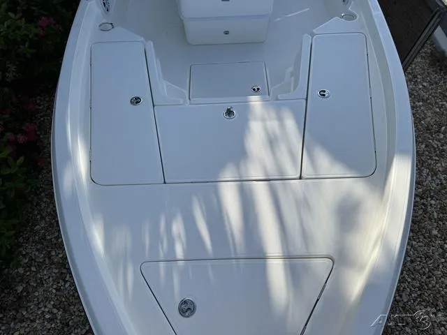 Slide: The Image of 2024 Skeeter SX230 boat deck with storage compartments. - 29