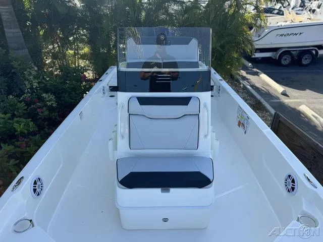 Slide: The Image of 2024 Skeeter SX230 boat interior with seating and console. - 31