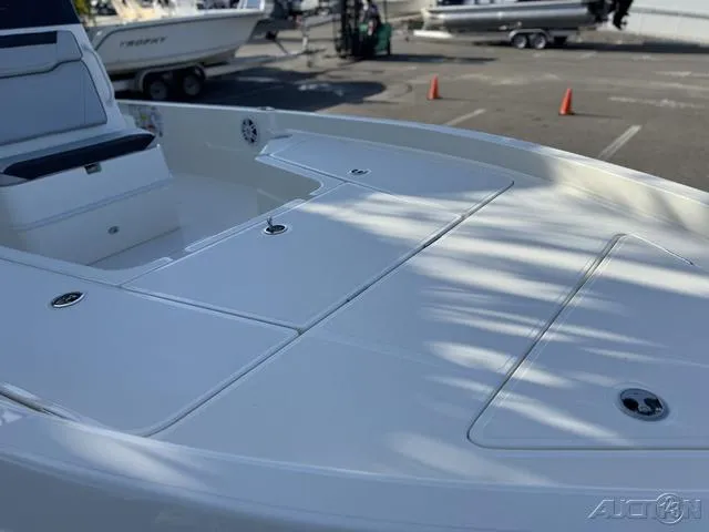 Slide: The Image of 2024 Skeeter SX230 boat deck with storage compartments. - 8